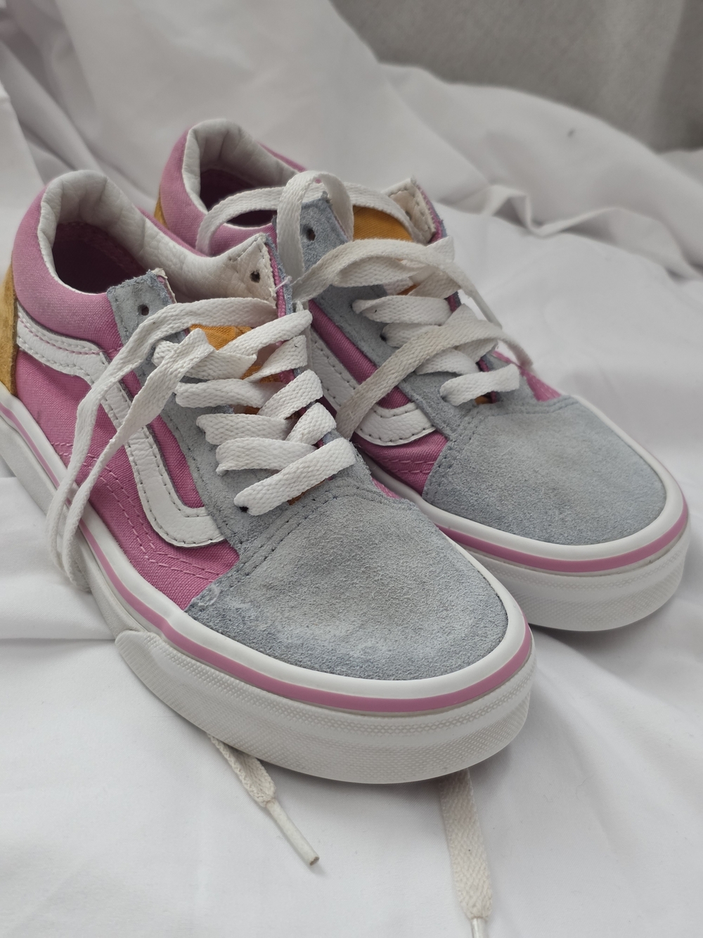 Kids Vans Old Skool color-block sneakers in pink, light grey, and yellow suede.